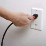 unplugging an electrical outlet