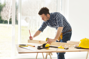 man completing DIY project in home