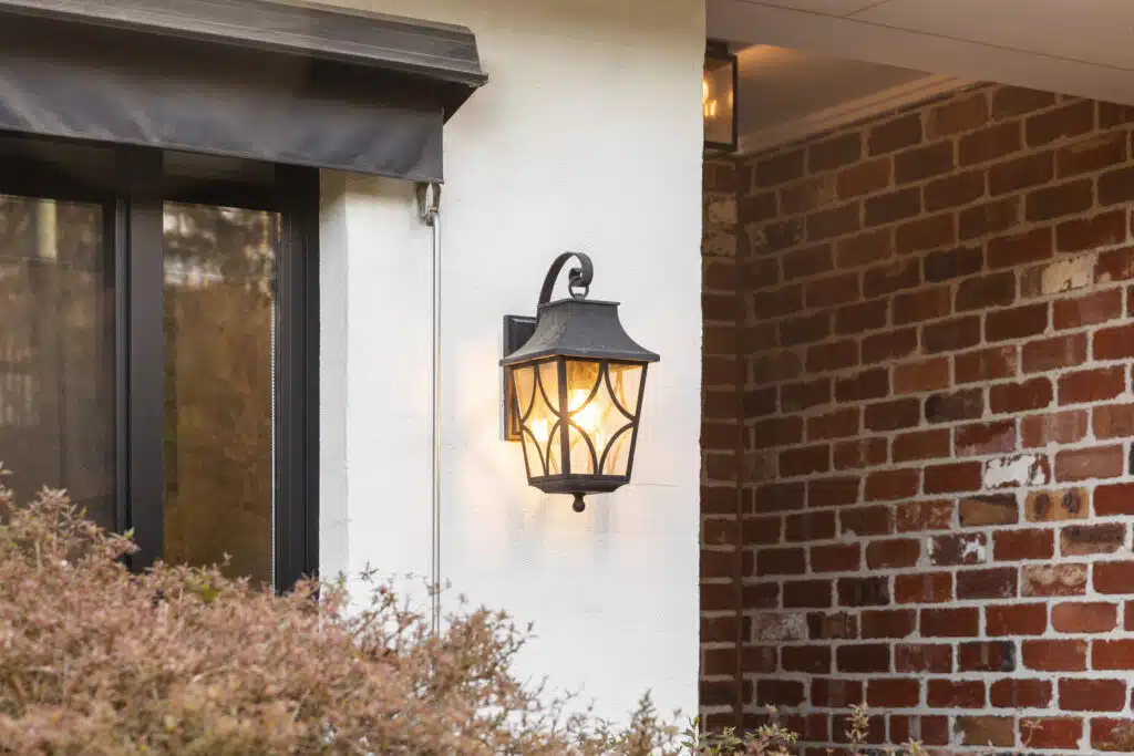 Vintage Iron Lantern Mounted on the Exterior Wall of House